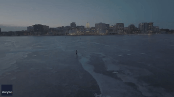 Ice Skaters Glide on Frozen Wisconsin Lake