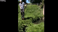 Man Tries to Jump Small Stream on Unicycle