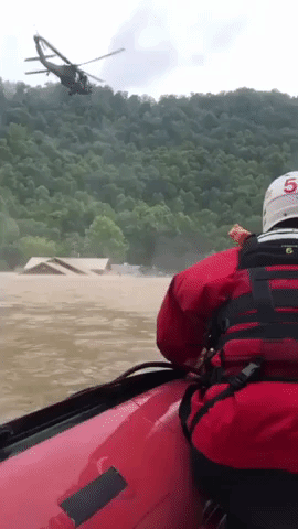 Emergency Responders Airlift Elderly Woman From Kentucky Flooding