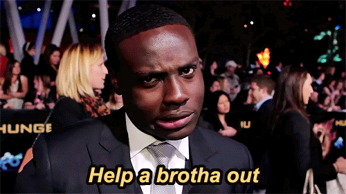 Video gif. A man in a suit giving a shrug and a playful expression to us, saying "Help a brotha out."
