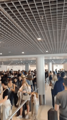 Passengers Face Huge Line for Flight Transfers at Schiphol Airport