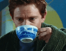 Movie gif. Martin Freeman as Arthur in The Hitchhiker's Guide to the Galaxy takes a sip of tea from a china teacup and mutters to himself in bliss as he looks up from the cup and sighs. 