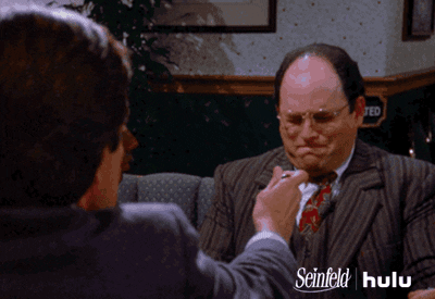 Seinfeld gif. Man holds spoon out to Jason Alexander as George, who shakes his head "no" emphatically and fearfully with his eyes and mouth closed tight