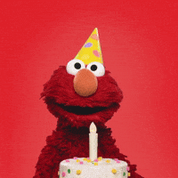 Sesame Street gif. Elmo wears a party hat as he takes a big breath and blows on a fake candle atop a birthday cake. Then he looks down and chuckles.