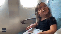 Flames Shoot From Plane Engine as Dad Films Daughter's Reaction to Takeoff