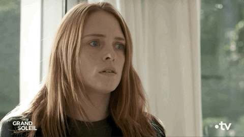 TV gif. Getting bad news, Melanie Maudran as Claire in Un Si Grand Soleil holds her hands up to her forehead in anguish.