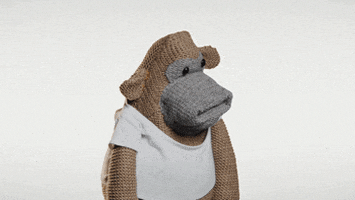 Video gif. A monkey puppet huffs his shoulders, scrunches his sock-like face, and trembles with anger.