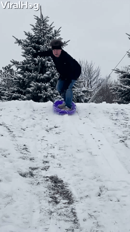 Manโs Sledding Stunt Ends in a Snowy Roll