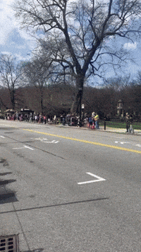 Crowd Cheers on Male Runners During Boston Marathon