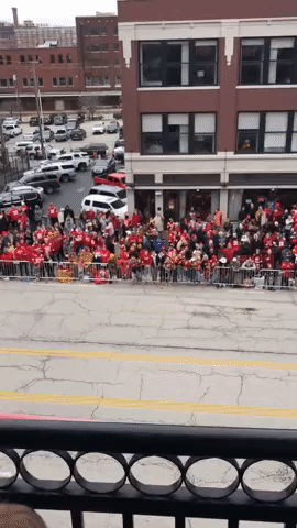 Chiefs Fans Cheer as Officer Catches Football in Kansas City Streets Before Super Bowl Victory Parade