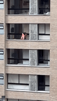 Woman Spotted on Ledge of Medellin High-Rise Cleaning Windows Without Safety Equipment