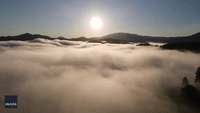 Drone Captures Sea of Clouds During Sunrise in Virginia