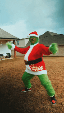 3D animated gif. Person wearing a Grinch Santa costume with a big belly and black and red sneakers holds out their arms and does an aggressive chest thrusting dance move with a creepy, somewhat sadistic expression on their face in a residential backyard setting. 