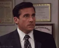The Office gif. Close-up of Steve Carell as Michael Scott shouting, 