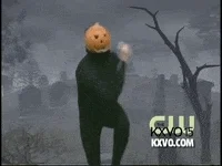 Video gif. Pumpkin Dance man in a black unitard with a jack-o-lantern on his head does dances from side-to-side in front of a graveyard backdrop. 