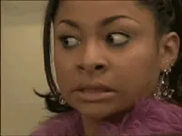 TV gif. Raven Symone's eyes dart around nervously while she chews gum.