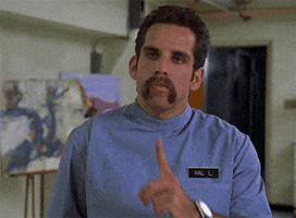 Movie gif. Ben Stiller as Hal L in Happy Gilmore. He's a tough looking nurse and he puts a finger to his lips before draws a thumb across his throat in a threatening manner