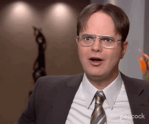 The Office gif. Rainn Wilson as Dwight bends slightly backward with a furrowed brow and says, "Wow!" 