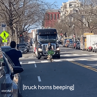 Lone Cyclist Slows Trucker Convoy in Washington