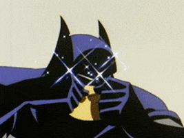 Cartoon gif. An amazed Batman rubs his eyes in wonder as glitter sparkles around his head.