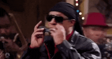 harmonica a legendary christmas GIF by NBC