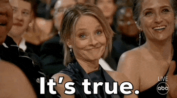 Oscars 2024 GIF. Jodie Foster, seated at the Oscars, nods in emphatic admission, reiterating, “It’s true.”