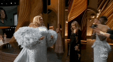 Oscars 2024 GIF. Da'Vine Joy Randolph walks on stage and accepts her Oscar from Jamie Lee Curtis. She immediately turns to Lupita Nyong'o, who was also a presenter for the award and a good friend of Randolph's, and reaches out to her for a hug.