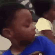 Meme gif. A little boy sitting at an angle turns to look at us with a sarcastic expression. The recording freezes and we zoom in on his face. 