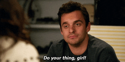 TV gif. Jake Johnson as Nick in New Girl. He gives a half-hearted wink and laughs a bit as he says, "Do your thing, girl!"