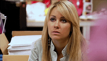 Reality TV gif. Lauren Conrad on The Hills blankly gazes ahead as if displeased as she bites her bottom lip. 