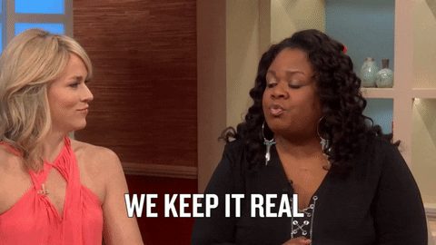 Gif of two people on talk show. One saying 'We keep it real' to the other.