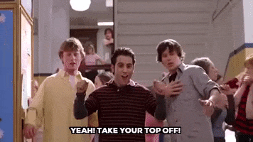 Movie gif. Daniel DeSanto as Jason in Mean Girls looks ahead as he cheers excitedly near two fellow male students. Text, "Yeah! Take your top off!"