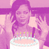 Video gif. Purple-tinted footage of an elegant-looking woman showing off her manicure with a smirk. An image of a birthday cake has been superimposed in front of her.