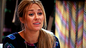 TV gif. Lauren Conrad puts her hands together and rests them under her chin as if saying "aww" to something sweet.