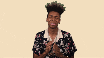 Celebrity gif. Masego begs dramatically, mouthing "please," while pressing his hands together intensely.
