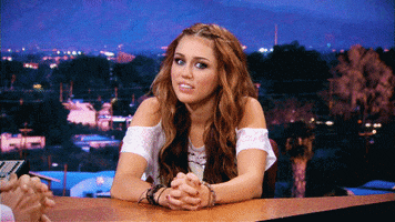 embarrassed miley cyrus GIF