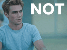 TV gif. KJ Apa as Archie in Riverdale. He looks away while he rubs his thighs from the cold and looks back us to say, "Not gonna happen."