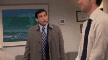 The Office gif. Steve Carell as Michael looks determined as he rushes toward John Krasinski as Jim and tackles him in a hug.