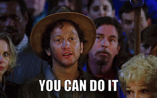 Movie gif. Rob Schneider as Townie in The Waterboy energetically points with a raised hand and determined face as he mouths the words that appear, "You can do it."