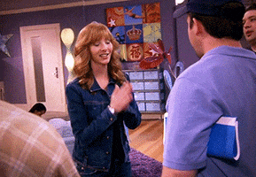 TV gif. Lisa Kudrow as Val Cherish on The Comeback smiles and nods, expressing gratitude to the production crew. 