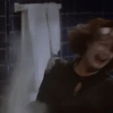 Movie gif. Faye Dunaway as Joan Crawford in Mommie Dearest throws a tantrum, screaming and crying and throwing white cleaning powder all around.